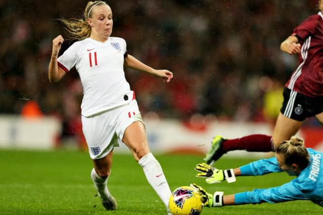 Beth Mead is fouled by the Germany goalkeeper.