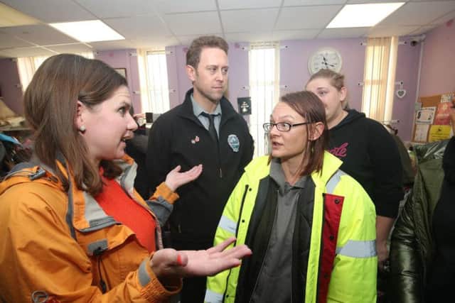 Liberal Democrats leader Jo Swinson speaks to volunteer Rosie Squires in the Stainforth 4 All charity shop during a visit to Stainforth in South Yorkshire to meet people affected by flooding. Pic: PA