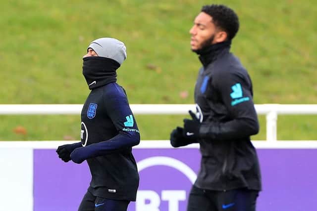 England's Raheem Sterling and Joe Gomez during the training session at St George's Park. Picture: Mike Egerton/PA
