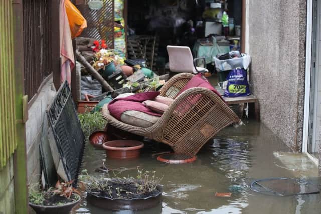 Belongings sit in floodwater outside a house  in Fishlake, Doncaster.