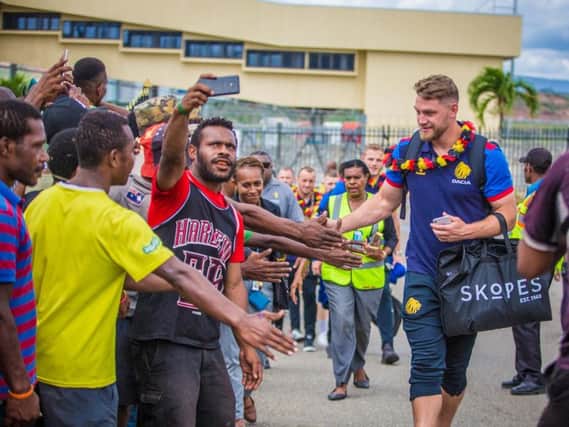 Elliott Whitehead meets locals after flying into PNG with Great Britain.