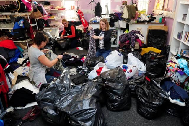Volunteers at the Stainforth for All shop, sort clothes out for the floods victims at Fishlake and Bentley. Picture by Simon Hulme