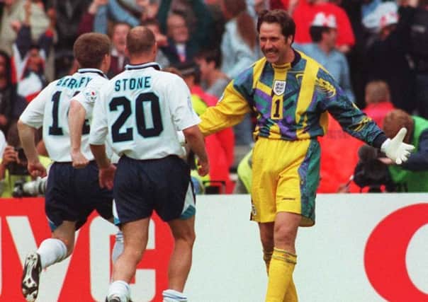 Yorkshireman David Seaman is congratulated by his team-mates Steve Stone and Nick Barmby after saving in the penalty shoot-out to decide the Euro 96 quarter-final clash against Spain, at Wembley. Picture: Adam Butler/PA Wire.