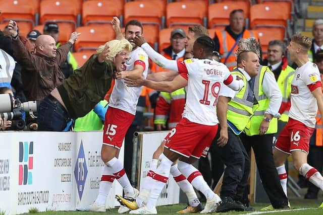 Rotherham United's Clark Robertson (No15 centre) celebrates scoring in a win at Blackpool.