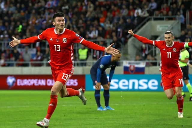 Wales' Kieffer Moore (left) celebrates scoring.