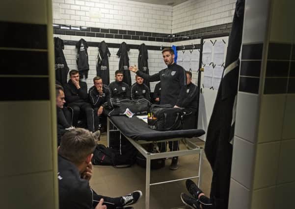 NOW HEAR THIS: Penistone Church FC manager Ian Richards gives his pre-match talk to his team. Picture: Tony Johnson
