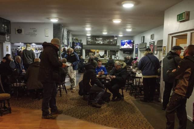 ALMOST TIME: Penistone Church Fans gather in the clubhouse ahead of the match against Hall Road Rangers.   Picture: Tony Johnson.