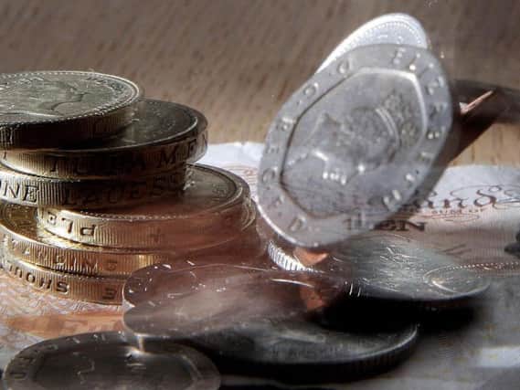 Stock photo of money as political parties discuss the minimum wage. Photo: Owen Humphreys/PA Wire