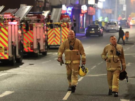 Fire fighters at the scene after a fire on the top floors of a building on Bradshawgate in Bolton. Picture date: Friday November 15, 2019.Photo credit: Peter Byrne/PA Wire