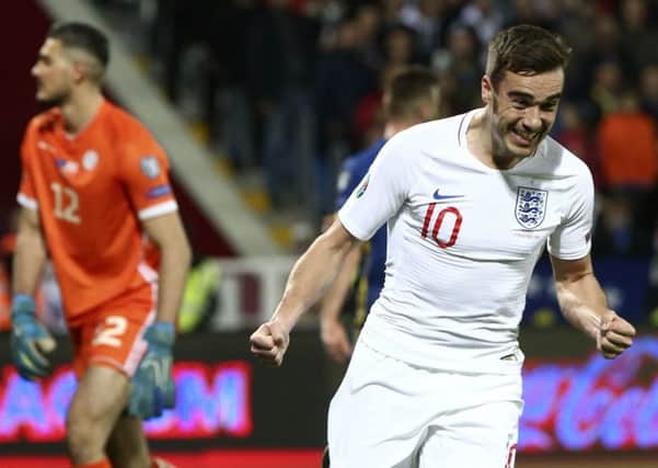 England's Harry Winks celebrates after scoring the opening goal of his team during the Euro 2020 group A qualifying soccer match between Kosovo and England at Fadil Vokrri stadium in Pristina. (AP Photo/Boris Grdanoski)
