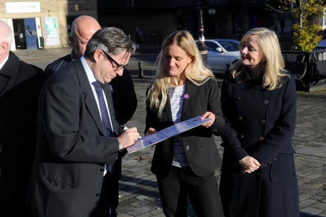 Batley and Spen Candidates call for a clean election campaign, pictured outside Jo Cox House, Batley..Pictured from the left , Mark Brooks (Conservative), Kim Leadbeater, Tracy Brabin (Labour). Photo: Simon Hulme