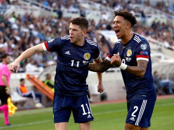Liam Palmer, right, celebrates Scotland's victory over Cyprus.