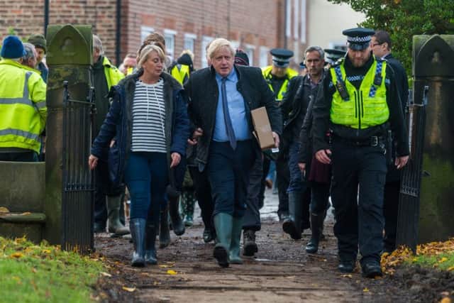 Boris Johnson received a rough reception from local residents over his delayed response to the South Yorkshire floods.