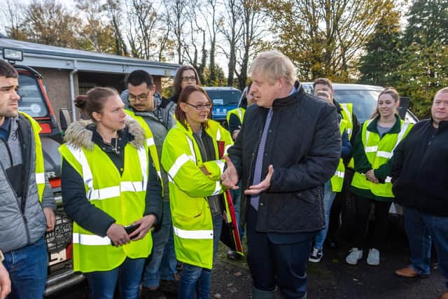 Boris Johnson meets response teams in flood-hit South Yorkshire. Pic: James Hardisty