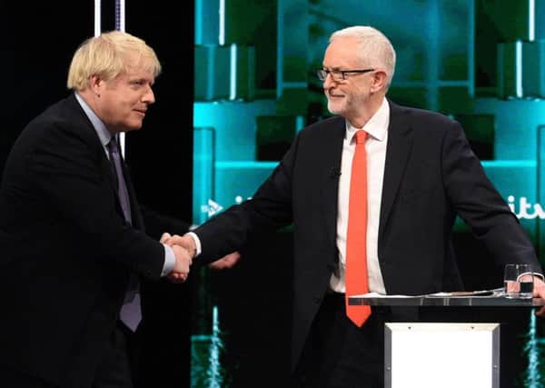 Boris Johnson and Jeremy Corbyn's awkward handshake after being challenged to work together to restore trust in politics.