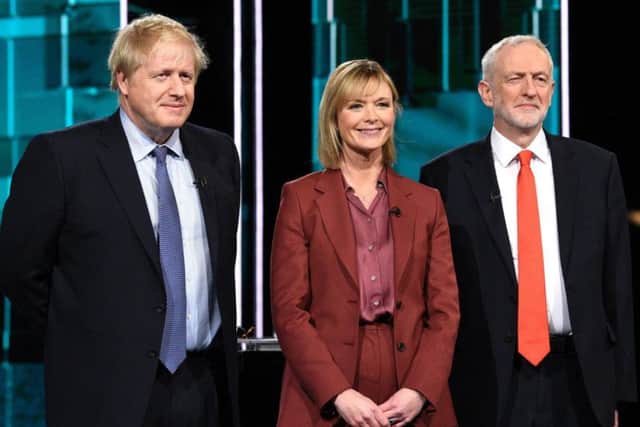 Boris Johnson, Jeremy Corbyn, and newscaster Julie Etchingham in the studio prior to tonight's election head-to-head debate on ITV. Photo: ITV/PA Wire