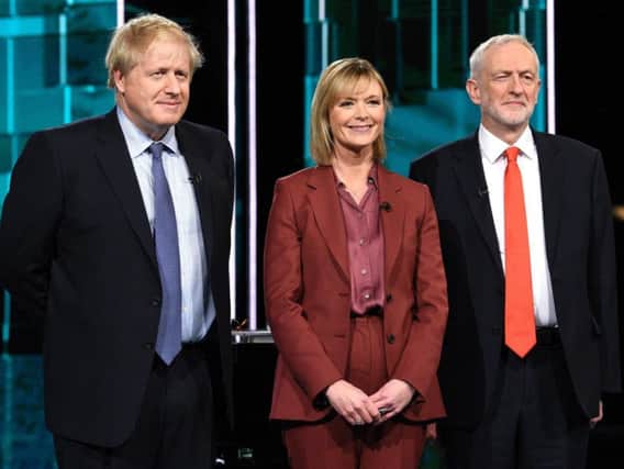 Boris Johnson and Jeremy Corbyn with Julie Etchingham. Photo: PA