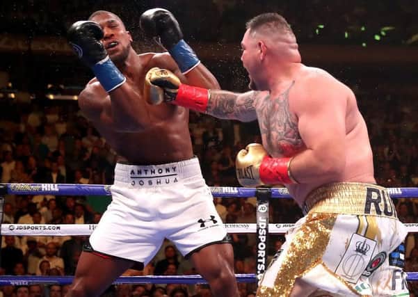 Andy Ruiz Jr (right) lands a punch on Anthony Joshua in the WBA, IBF, WBO and IBO Heavyweight World Championships title fight back in June.