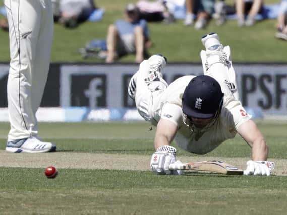 Made it: England's Dom Sibley dives to make his ground