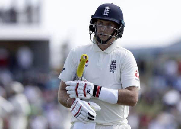 Failed: England's Joe Root walks from the field after he was dismissed for two runs.