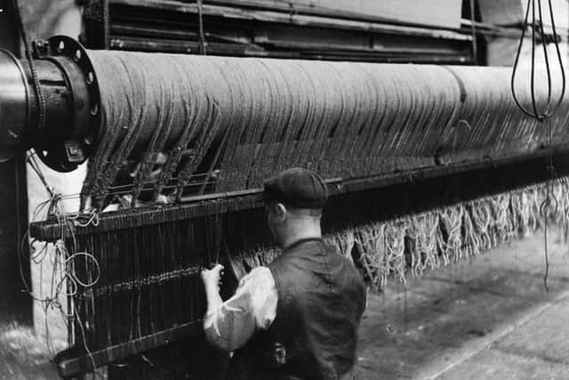 A worker using a machine in a textiles mill near Leeds. Many suffragettes in Yorkshire saw the fight for votes and the fight for better working conditions as inextricably linked.