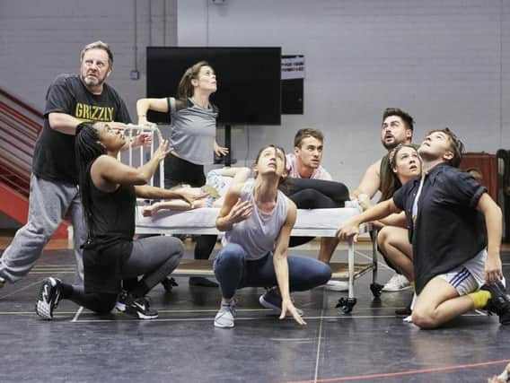 The company in rehearsal for The Wizard of Oz at Leeds Playhouse.