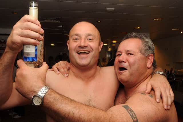 Dons' Carl Hall and coach Tony Miller celebrate after their side won the league. (Picture: Andrew Roe)