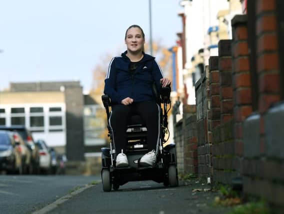 Tiffany Pearson from Whitby, who was paralysed at 18 by a narrowing of her spinal cord. This month she marks a decade since she lost use of her legs, but she is finally in a good place both physically and mentally and now in an electric wheelchair, helping her with independence and freedom. Image: Jonathan Gawthorpe.