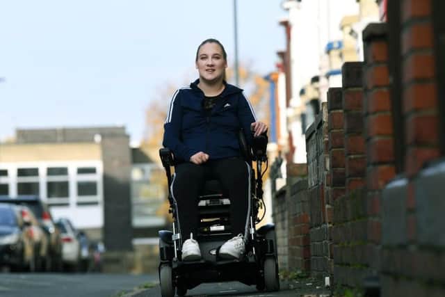 Tiffany Pearson from Whitby, who was paralysed at 18 by a narrowing of her spinal cord. This month she marks a decade since she lost use of her legs, but she is finally in a good place both physically and mentally and now in an electric wheelchair, helping her with independence and freedom. Image: Jonathan Gawthorpe.