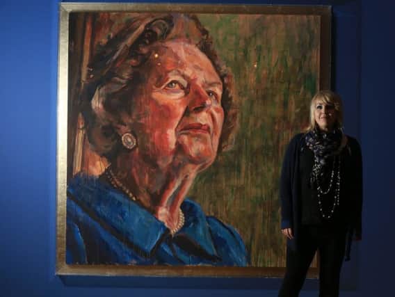 Lorna May Wadsworth next to her portrait of Margaret Thatcher, part of her retrospective, Gaze, at the Graves Gallery in Sheffield.