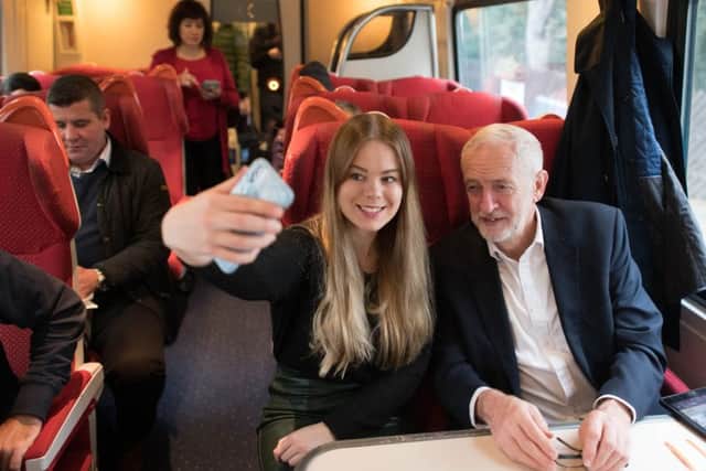Jeremy Corbyn meets a supporter on a train after the Question Time leaders' event in Sheffield.