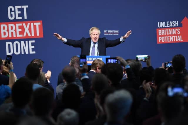 Boris Johnson takes to the stage to launch the Tory party's general election manifesto.