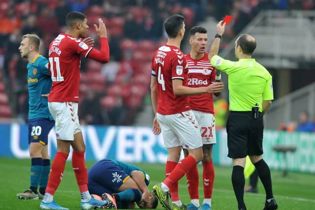 Marvin Johnson is shown the red card after his challenge on Tigers captain Eric Lichaj.  PIC: Tony Johnson.