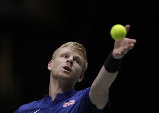 Great Britain's Kyle Edmund serves to Spain's Feliciano Lopez during their Davis Cup semi-final match.