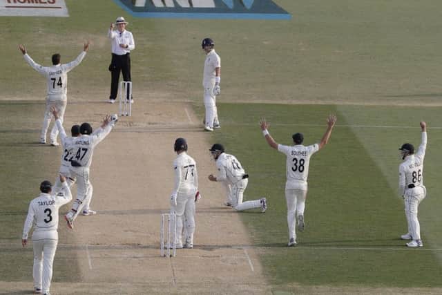 New Zealand players celebrate the dismissal of England's Jack Leach.