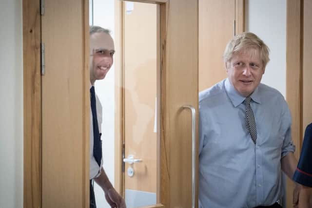 Follow my leader - Health Secretary Matt Hancock (left) with the PM on a joint visit to Bassetlaw Hospital.