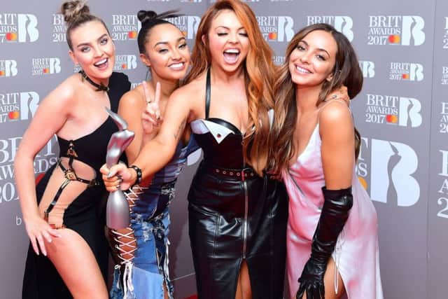 Little M ix's Jesy Nelson (third left) has spoken out about the pressures of appearing on The X Factor.