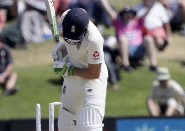 Poor choice: England's Jos Buttler is bowled after playing no shot.