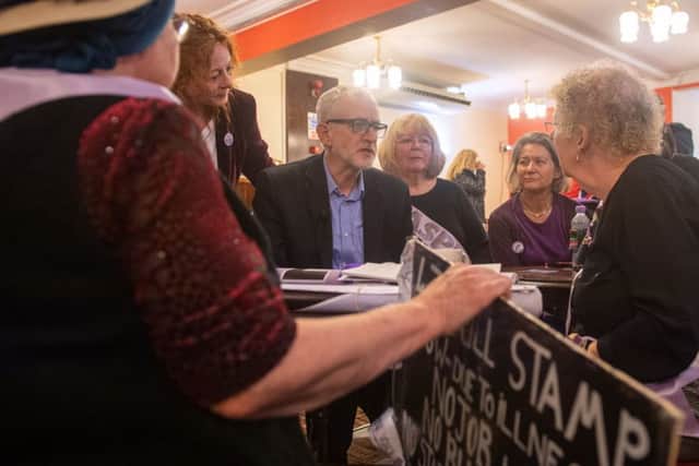 Labour  leader Jeremy Corbyn speaks with a group of WASPI (Women against state pension inequality) supporters during a visit to the Renishaw Miners Welfare, in Renishaw, Sheffield, yesterday.