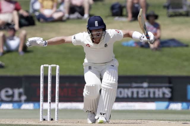 England's Joe Denly reacts while batting during play on the final day of the first cricket test between England and New Zealand at Bay Oval in Mount Maunganui. (AP Photo/Mark Baker)