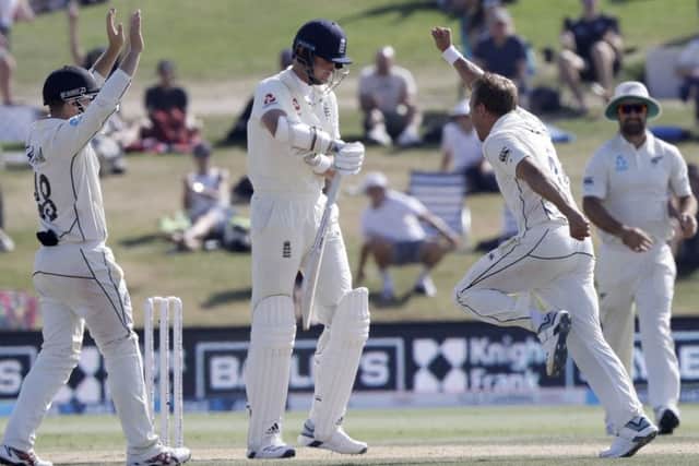 New Zealand's Neil Wagner celebrates after dismissing England's Stuart Broad, centre on the final day of the first cricket test between England and New Zealand at Bay Oval in Mount Maunganui, New Zealand. (AP Photo/Mark Baker)