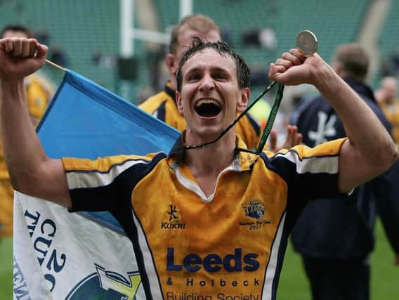 Leeds Tykes' Alan Dickens celebrates with his medal after helping his side to victory over Bath in the 2005 Powergen Cup final at Twickenham. (Photo by Christopher Lee/Getty Images)