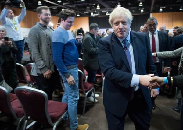Boris Johnson leaves the stage after launching his election manifesto.