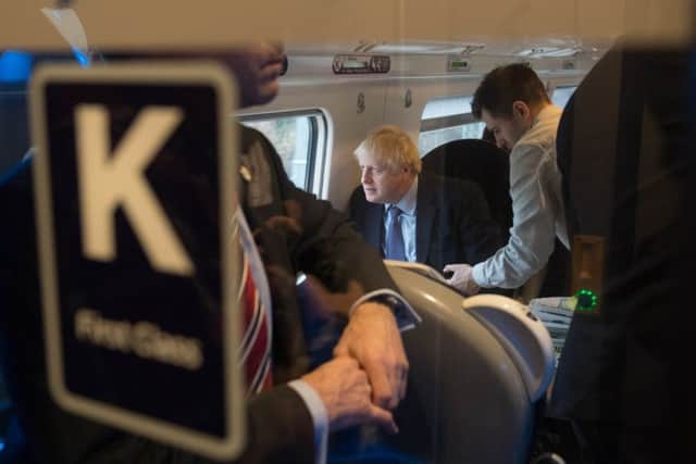 Boris Johnson travelled by train in  a first class carriage to the launch of his party's election manifesto.