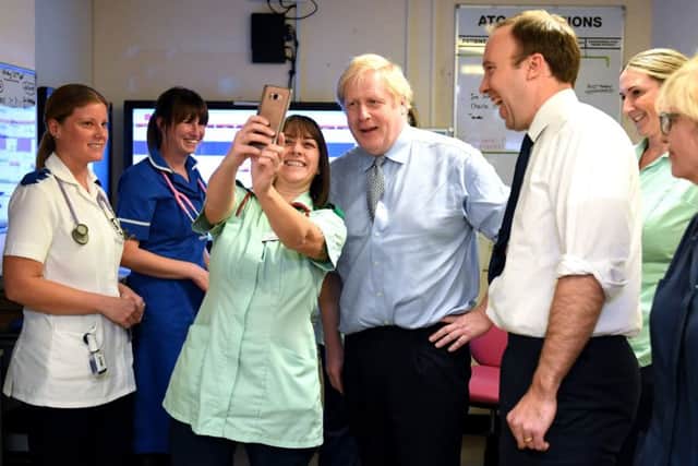Boris Johnson and Matt Hancock (right) have been told to put the care of patients before targets.