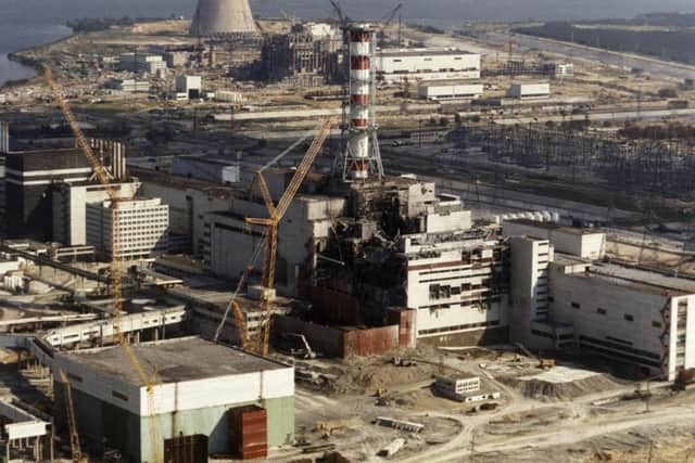 Photo, dated 01 October 1986, showing repairs being carried out on the Chernobyl nuclear plant in the Ukraine, following a major explosion 26 April 1996 which, according to official statistics, affected 3,235,984 Ukrainians and sent radioactive clouds all over Europe. (Photo credit: ZUFAROV/AFP/Getty Images)