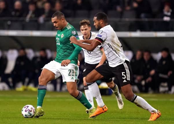 Hull City's  Josh Magennis (left) in action for Northern Ireland against Germany's Jonathan Tah. Picture: John Walton/PA