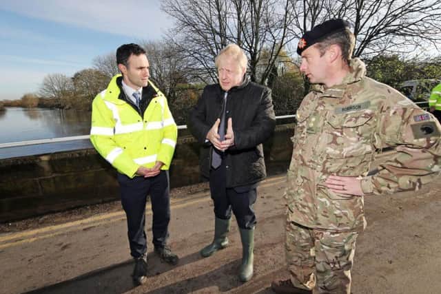 Boris Johnson surveys the floods in South Yorkshire - Getty Images