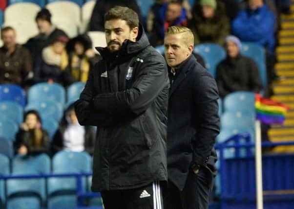 As close as they got: Rivals Pep Clotet, left, and Owls chief Garry Monk. Picture: Steve Ellis