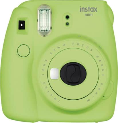 Fujifilm's instant camera may be a fad but it can instantly fill someone's stocking